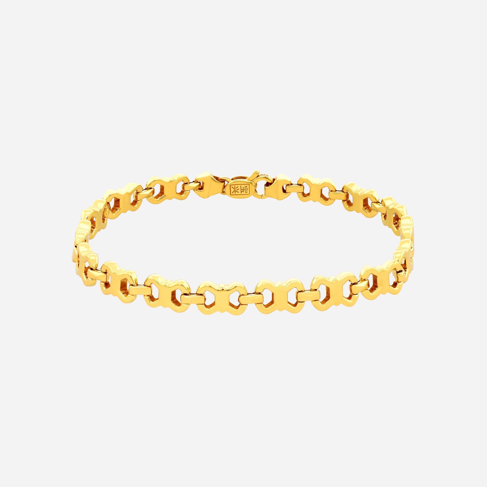 Luminous Link Bracelet in polished 22K yellow gold with barrel beads and delicate golden spacers. Elegant design.