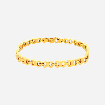 Luminous Link Bracelet in polished 22K yellow gold with barrel beads and delicate golden spacers. Elegant design.