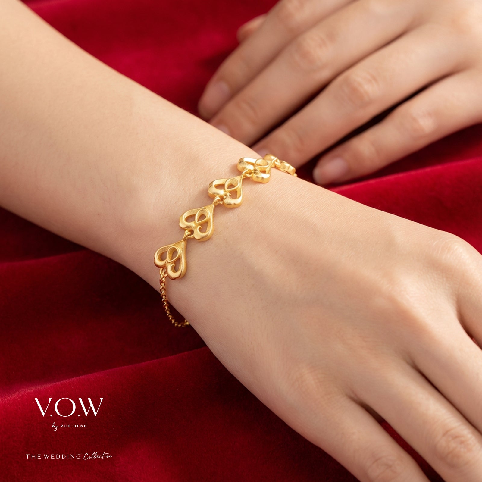 Double Phoenix Bracelet in 24K Yellow Gold featuring heart-shaped links, symbolizing happiness and compassion.