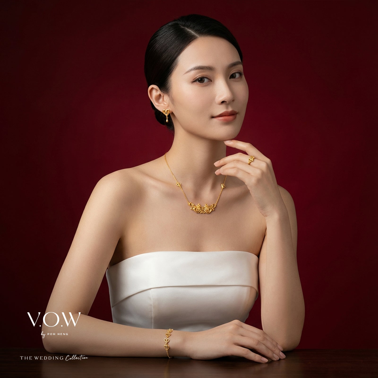 Double Phoenix bracelet in 24K yellow gold featuring a delicate, elegant design representing happiness and blessings.