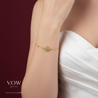 Aurora Bloom Bracelet in yellow gold with a clover motif accented by green enamel, exuding elegance and charm.