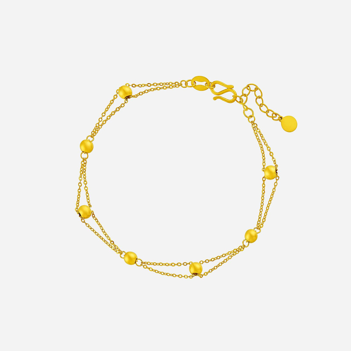 24K yellow gold beaded bracelet with delicate beads on a triple-strand chain, perfect for any occasion.