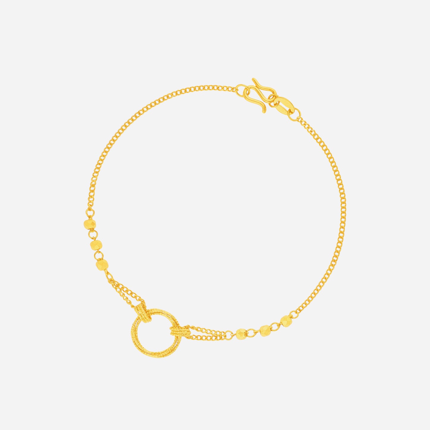 circle link bracelet in 24k yellow gold featuring a polished circular centerpiece and fine gold chain design.