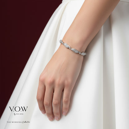Shimmering cascade bracelet in 18K white gold with diamond accents, featuring delicate links for a fluid design.