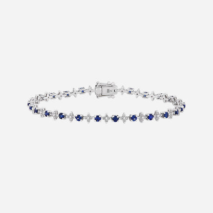Opulent blue sapphire and diamond bracelet in 18K white gold, featuring alternating stones in an elegant design.