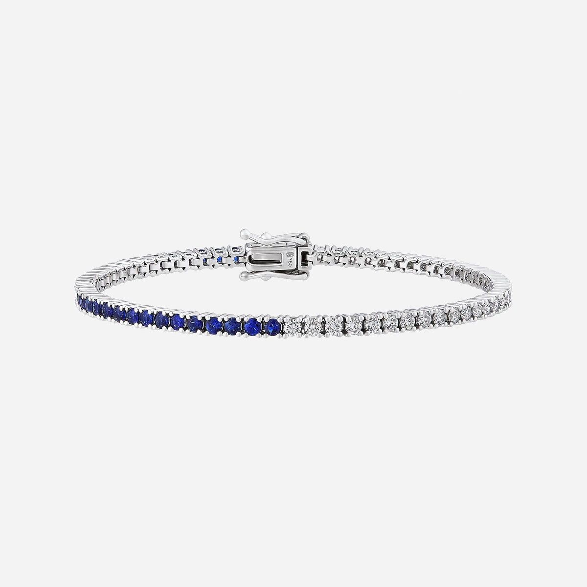 blue sapphire and diamond bracelet in 18k white gold, featuring alternating blue and clear stones in a delicate design.