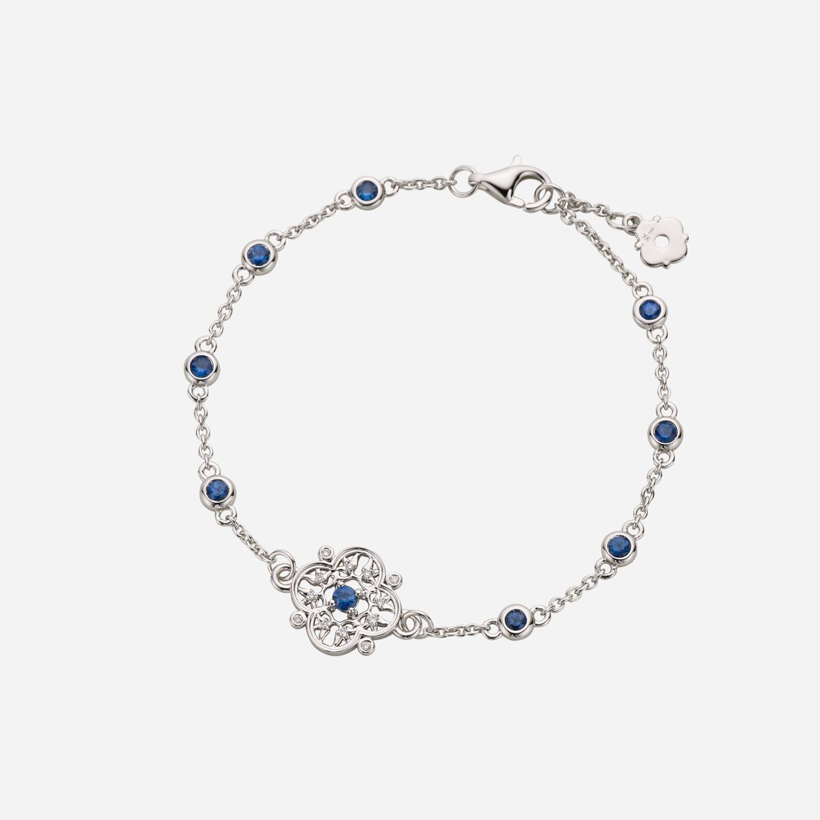 Legacy floral sapphire diamond bracelet in white gold with blue sapphires and detailed floral design.