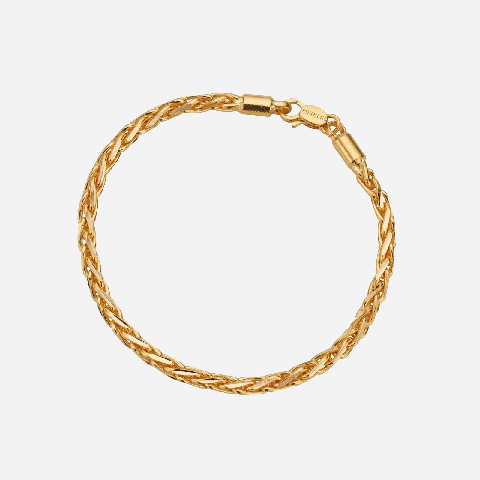 Wheat bracelet in 22K yellow gold, intricately woven design with a secure clasp detail. Classic and timeless jewelry piece.
