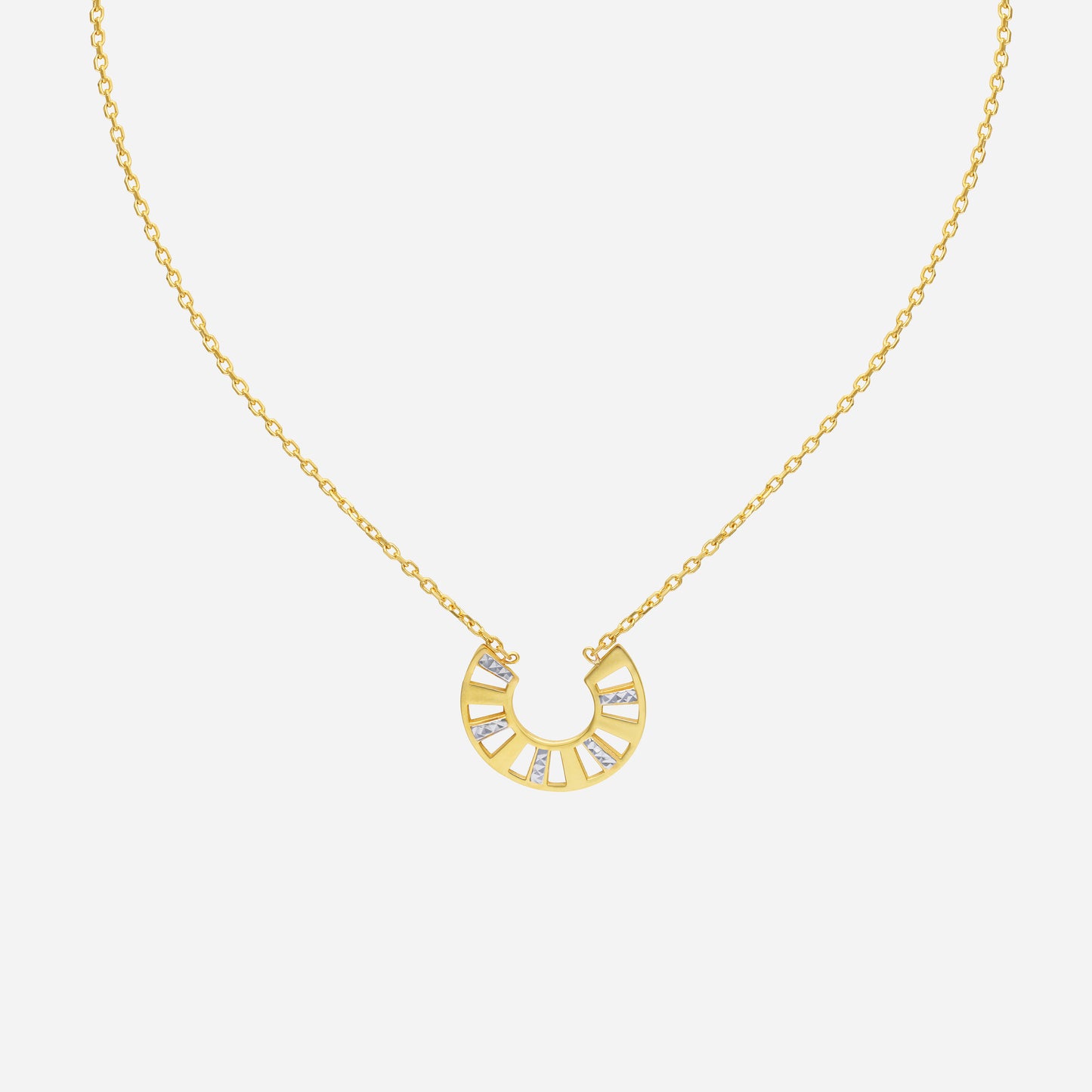 arc curve necklace in 22k yellow and white gold with a modern arc design and geometric gemstone accents.