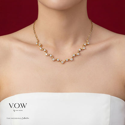 Flowing Romance Necklace in yellow and white gold showcasing a wavy design with sparkling gemstones. Perfect for weddings.