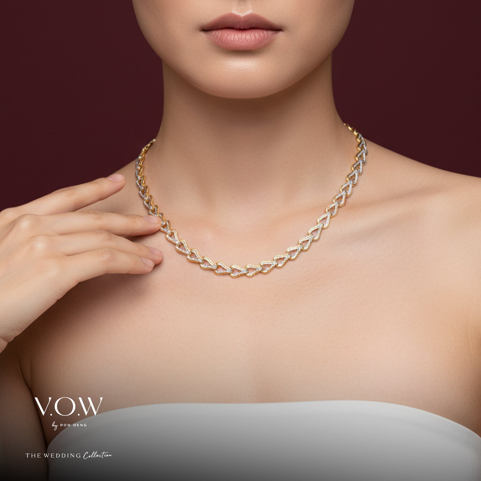 Elegant Omega necklace in 22K yellow and white gold, showcasing a sophisticated heart-shaped link design.