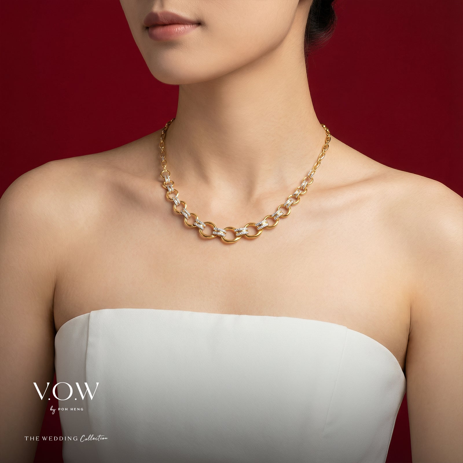 Elegance Torus Necklace in yellow and white gold with sculpted link design and sparkling accents.