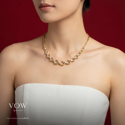 Elegance Torus Necklace in yellow and white gold with sculpted link design and sparkling accents.