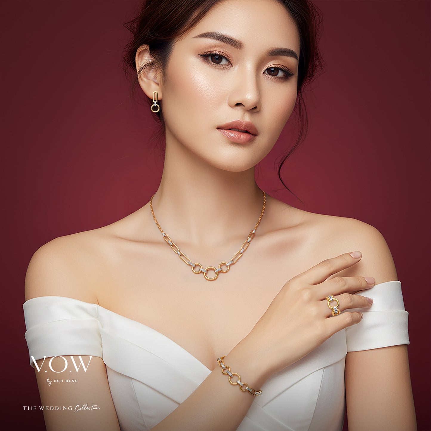 circle of glamour necklace in 22k yellow and white gold with linked circular design, worn with matching earrings.