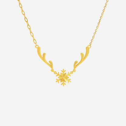 Snow Crown Necklace in 22K yellow gold featuring a snowflake centerpiece and delicate branch accents. Elegant and airy design.