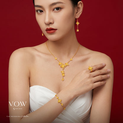 Delicate 24K yellow gold flower necklace showcasing intricate floral design and feminine elegance. Perfect for any occasion.