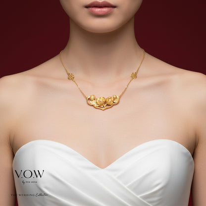 Lotus Harmony Necklace in 24K yellow gold, featuring twin lotus blooms on a delicate chain, embodies blessings and elegance.