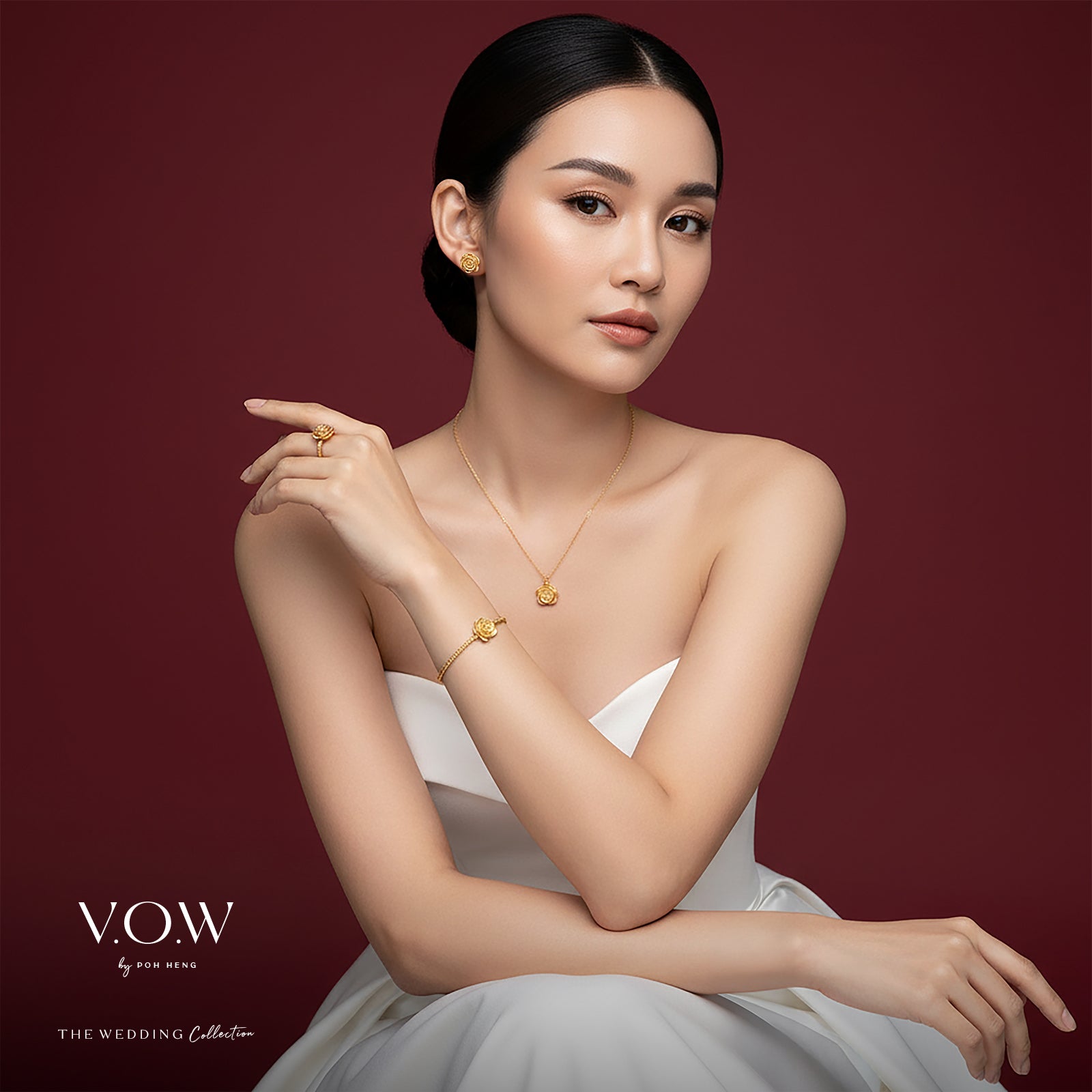 24K yellow gold rose necklace with elegant floral design, worn by a model in a wedding dress setting.