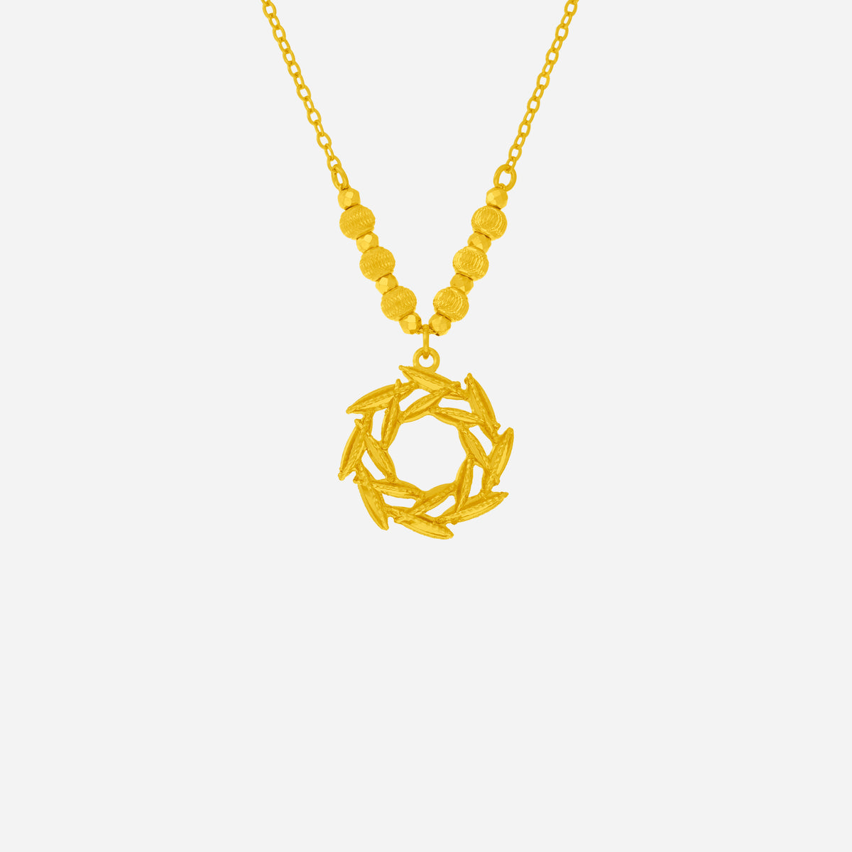 dazzling willow necklace in 24k yellow gold featuring layered leaves in a circular design with textured beads.