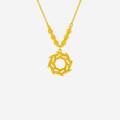 Dazzling Willow Necklace in 24K yellow gold featuring layered leaves in a circular design with textured beads.