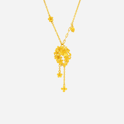 Vibrant Bloom Necklace in 24K Yellow Gold featuring sculpted floral designs and cascading tassels for a graceful look.