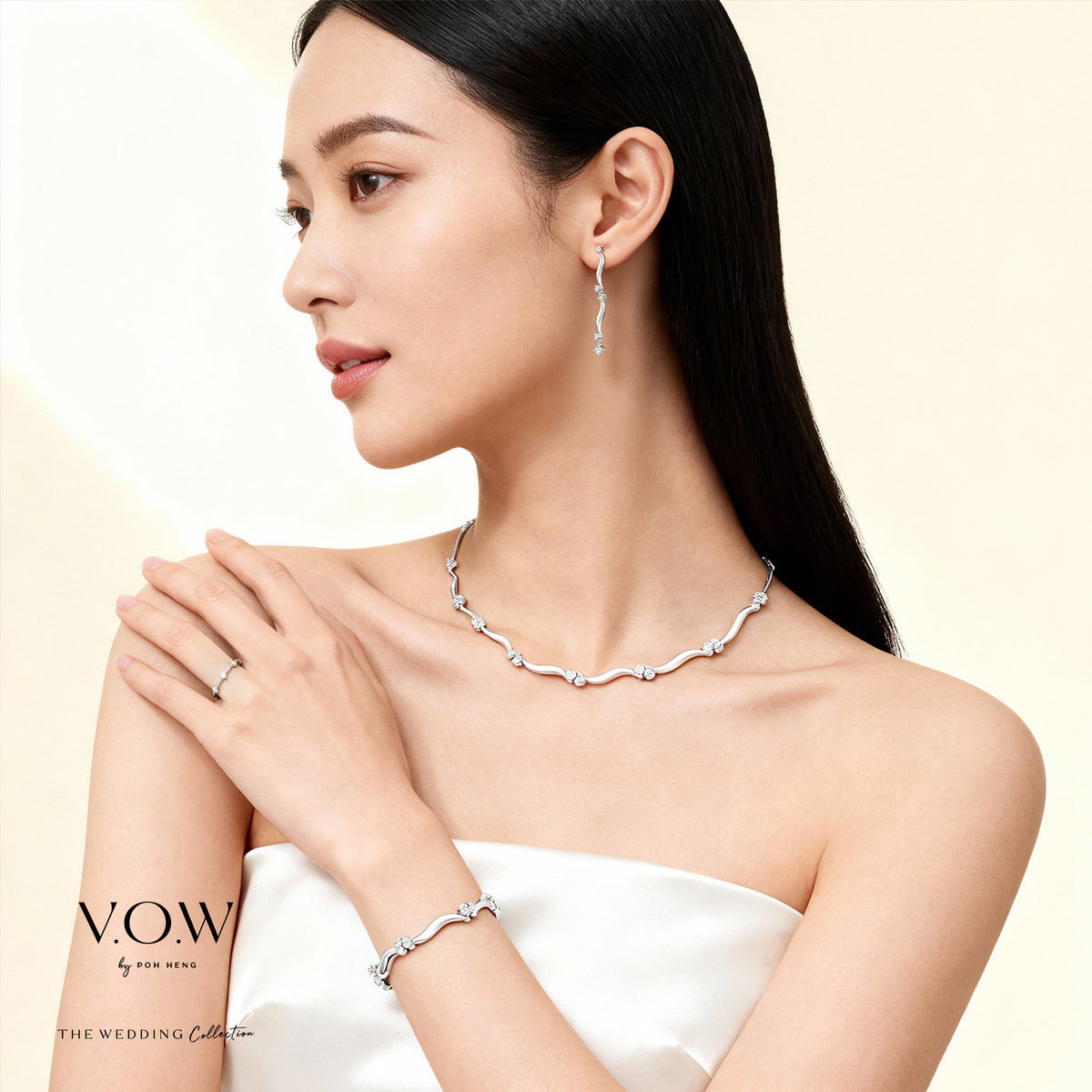 caressing waves diamond necklace in 18k white gold with shimmering diamonds and fluid design, paired with matching jewellery.