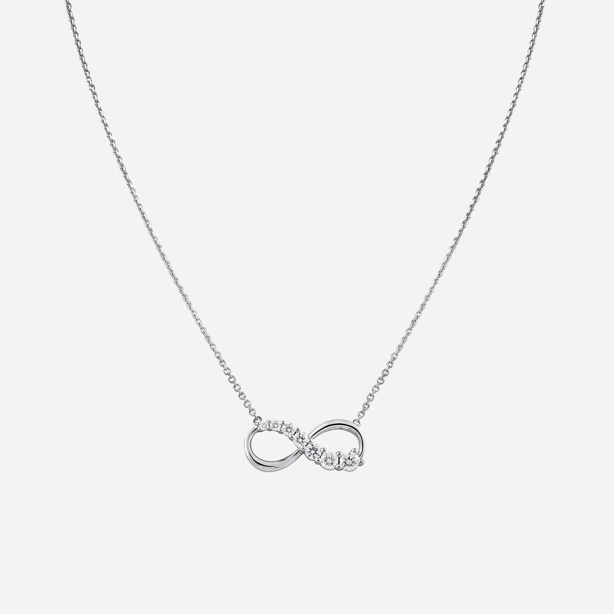 Love Journey infinity necklace in 18K white gold with brilliant cut diamonds in ascending sizes. Elegant design.