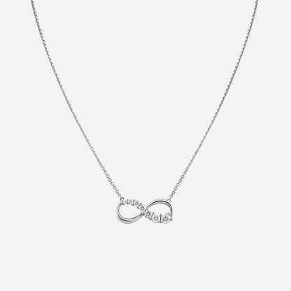 Love Journey infinity necklace in 18K white gold with brilliant cut diamonds in ascending sizes. Elegant design.