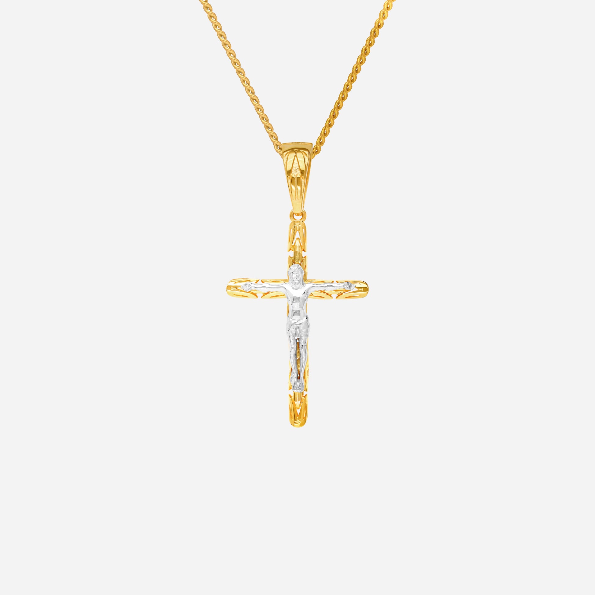 Crucifix pendant in 22K yellow and white gold, sculpted cross design with a central figure. Chain not included.