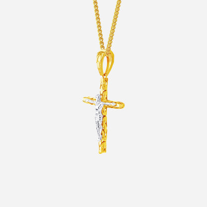 22K yellow and white gold crucifix pendant with a sculpted cross design, featuring contrasting tones and intricate details.