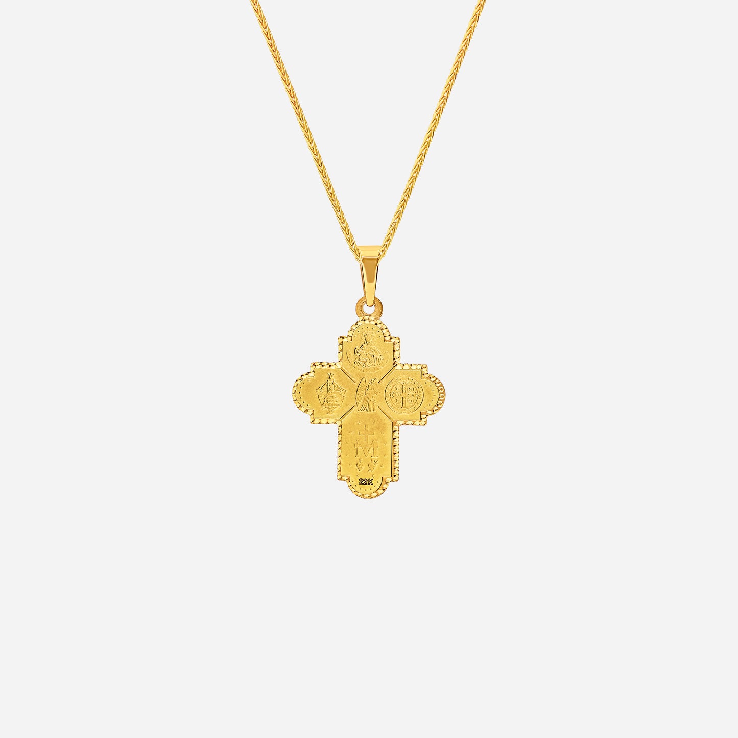 four way cross pendant in 22k yellow gold featuring intricate religious symbols and a central dove of peace design.