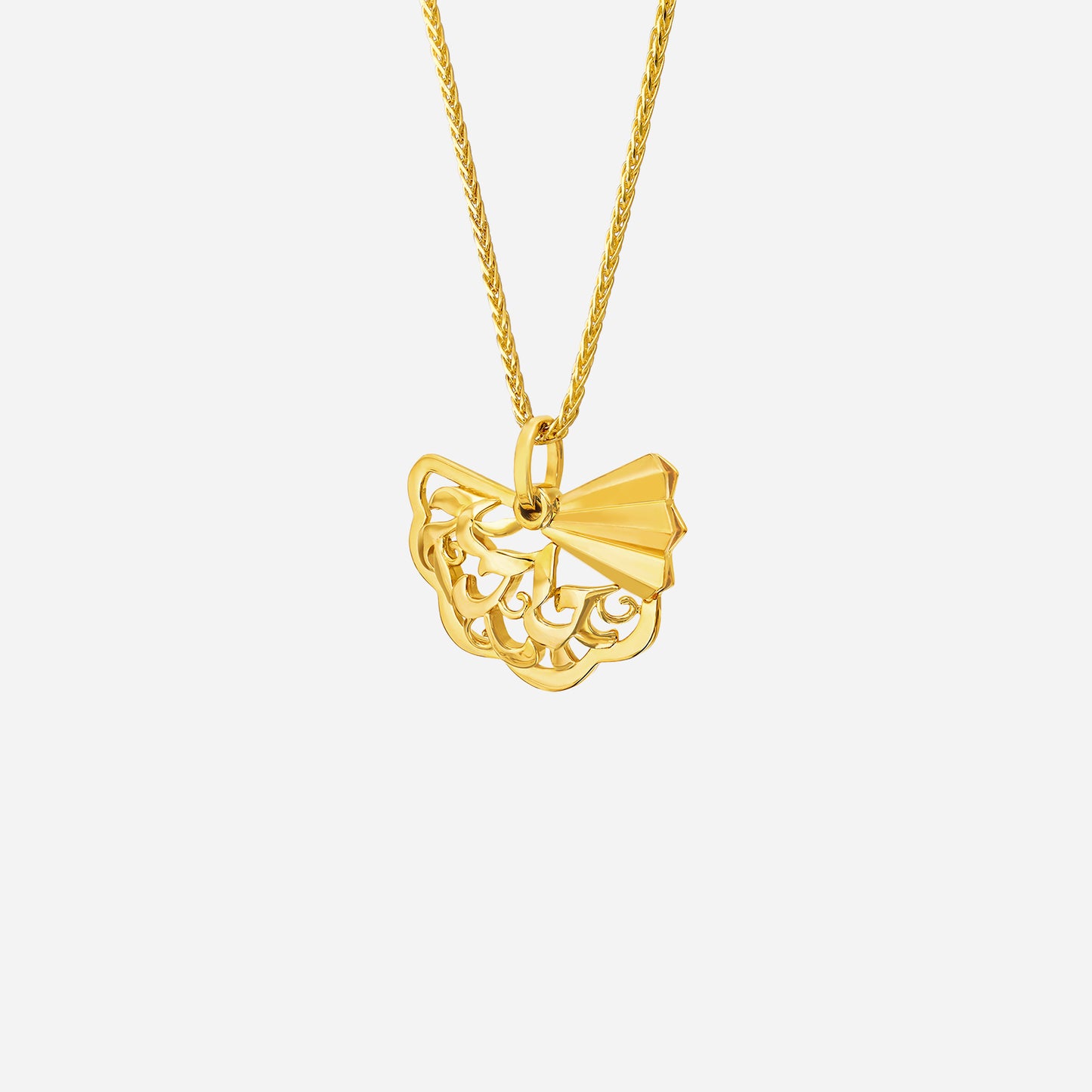 legacy fan pendant in 22k yellow gold features intricate lacework and a delicate fan design with a knot detail.