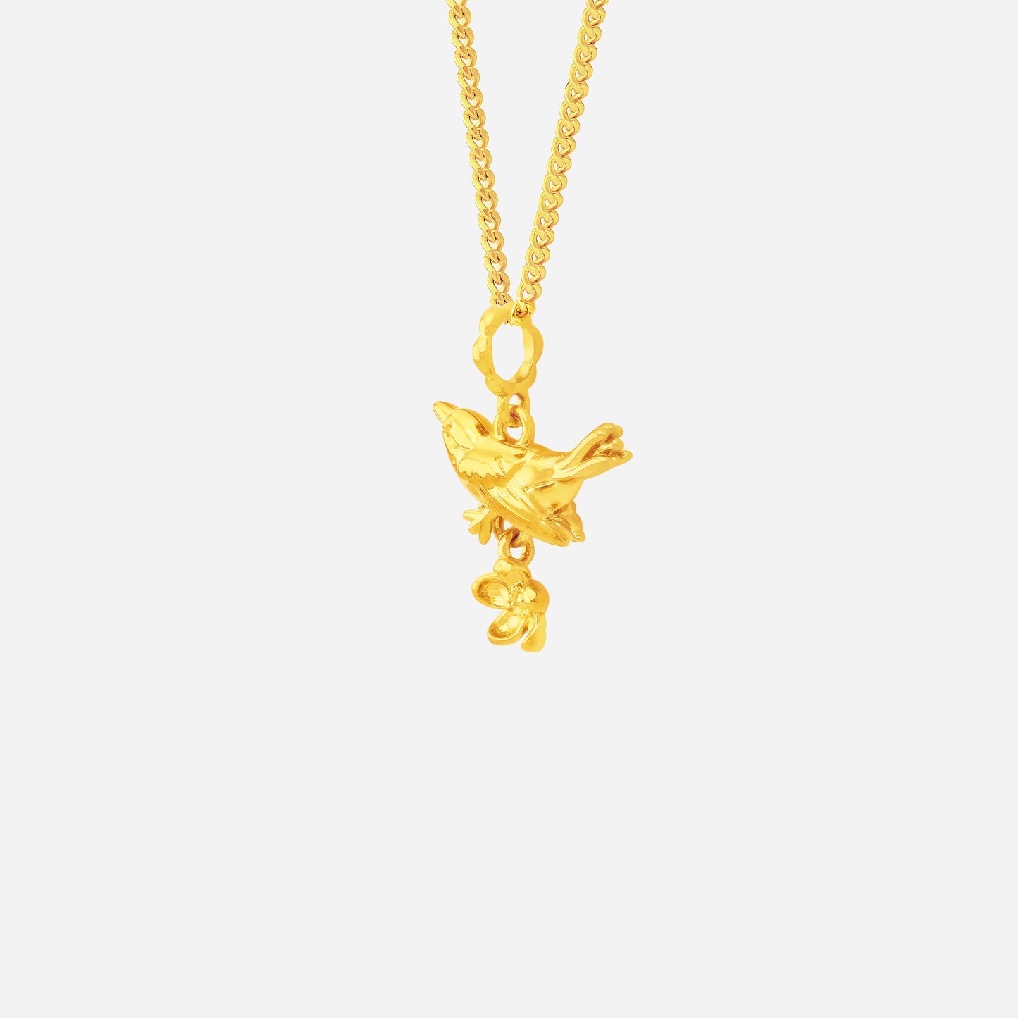 blooming bird pendant in 22k yellow gold with intricate bird and flower design, embodying elegance and grace.