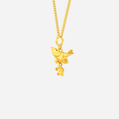 Blooming Bird Pendant in 22K Yellow Gold with intricate bird and flower design, embodying elegance and grace.