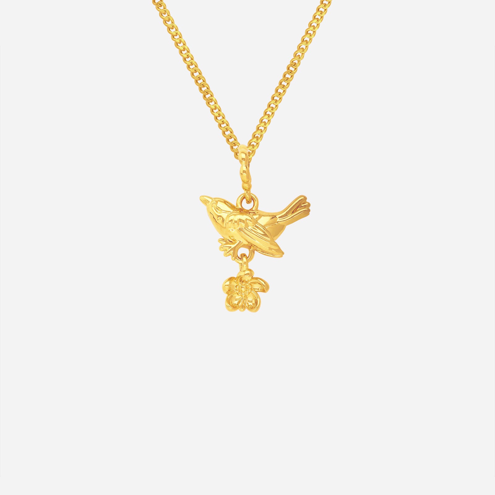 Blooming Bird Pendant in 22K yellow gold featuring a bird and delicate flower design. Elegant and whimsical style.