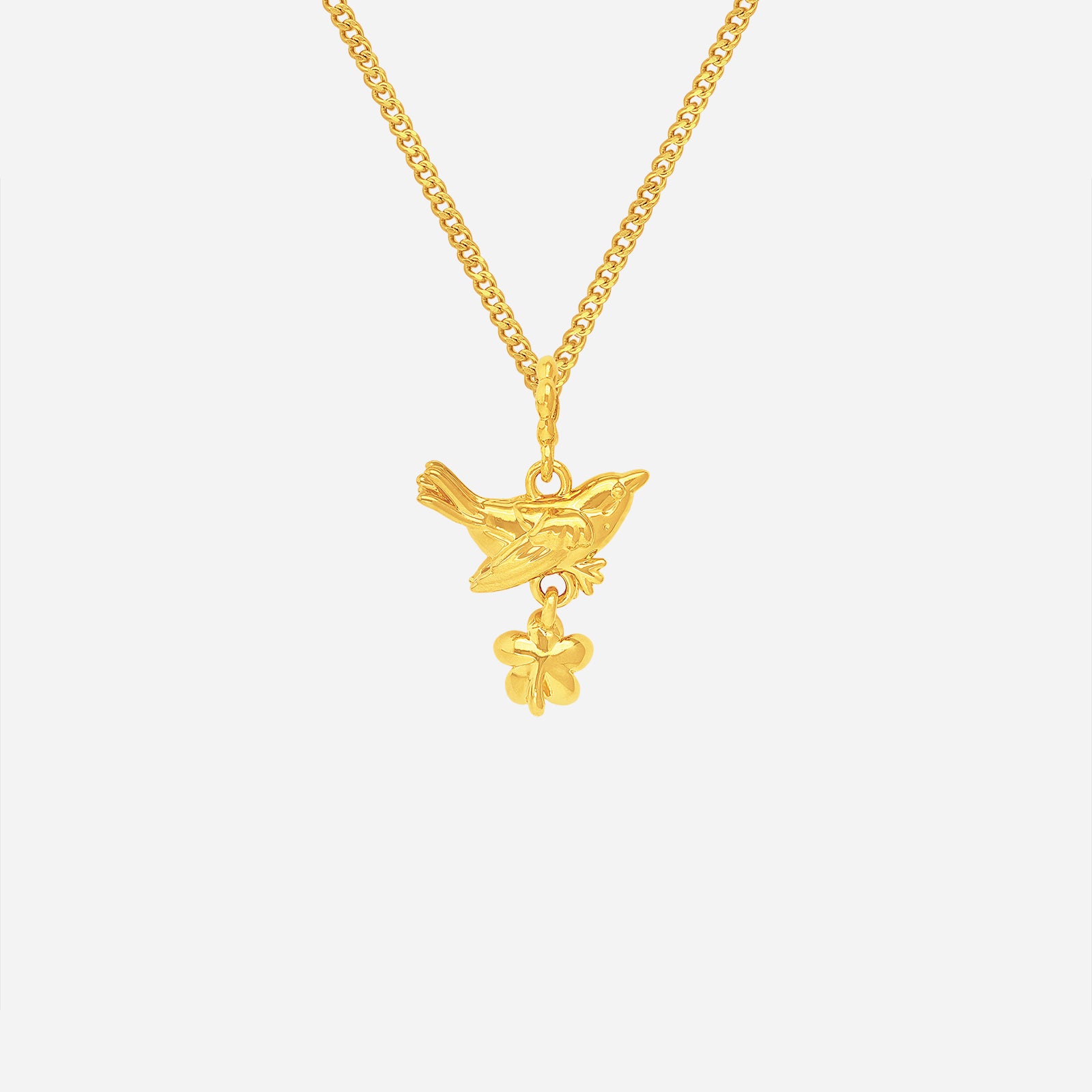 Blooming Bird Pendant in 22K Yellow Gold featuring an elegant bird design with a delicate flower charm below.