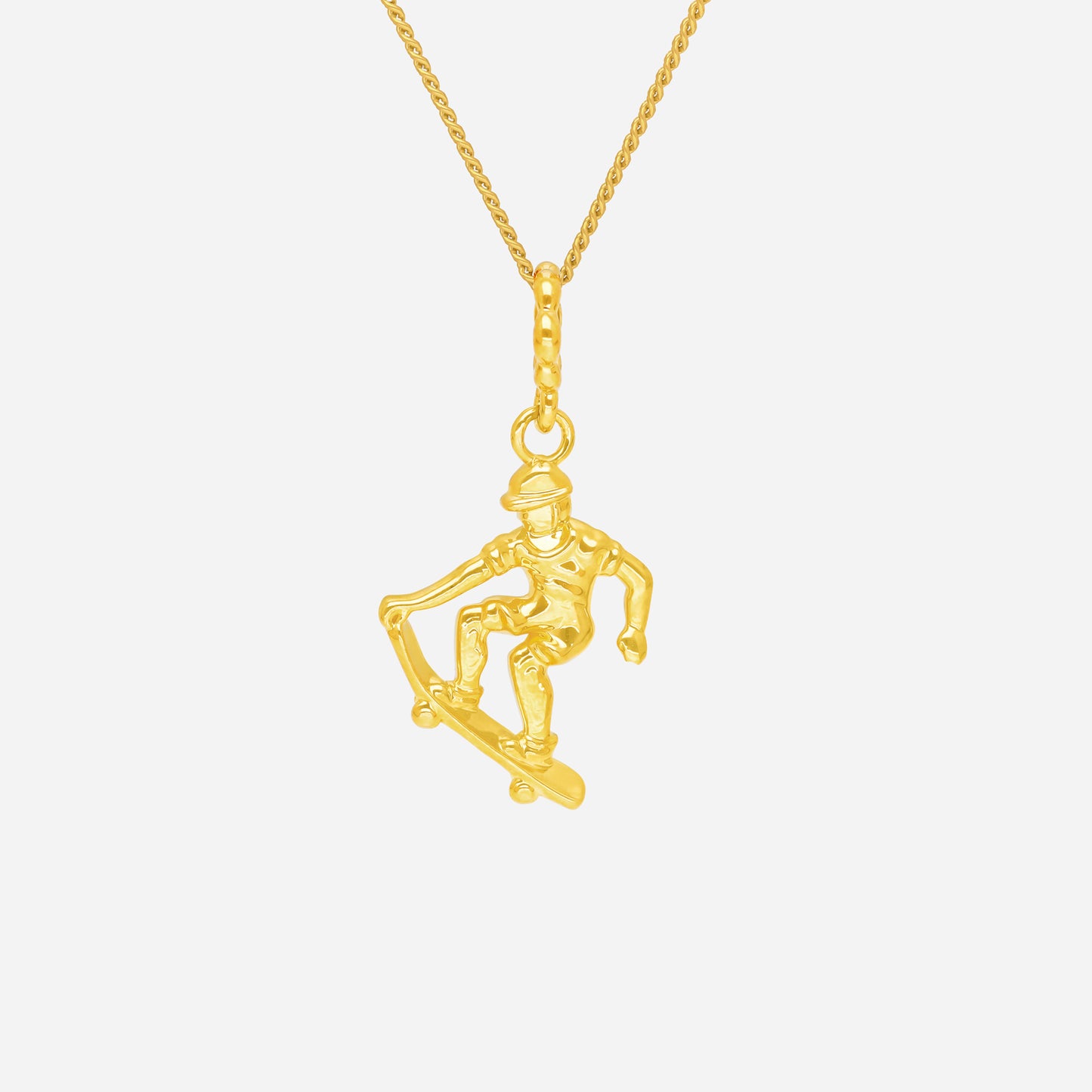 ace of skateboarding pendant in 22k yellow gold, depicting a skateboarder in dynamic motion on a gold chain.