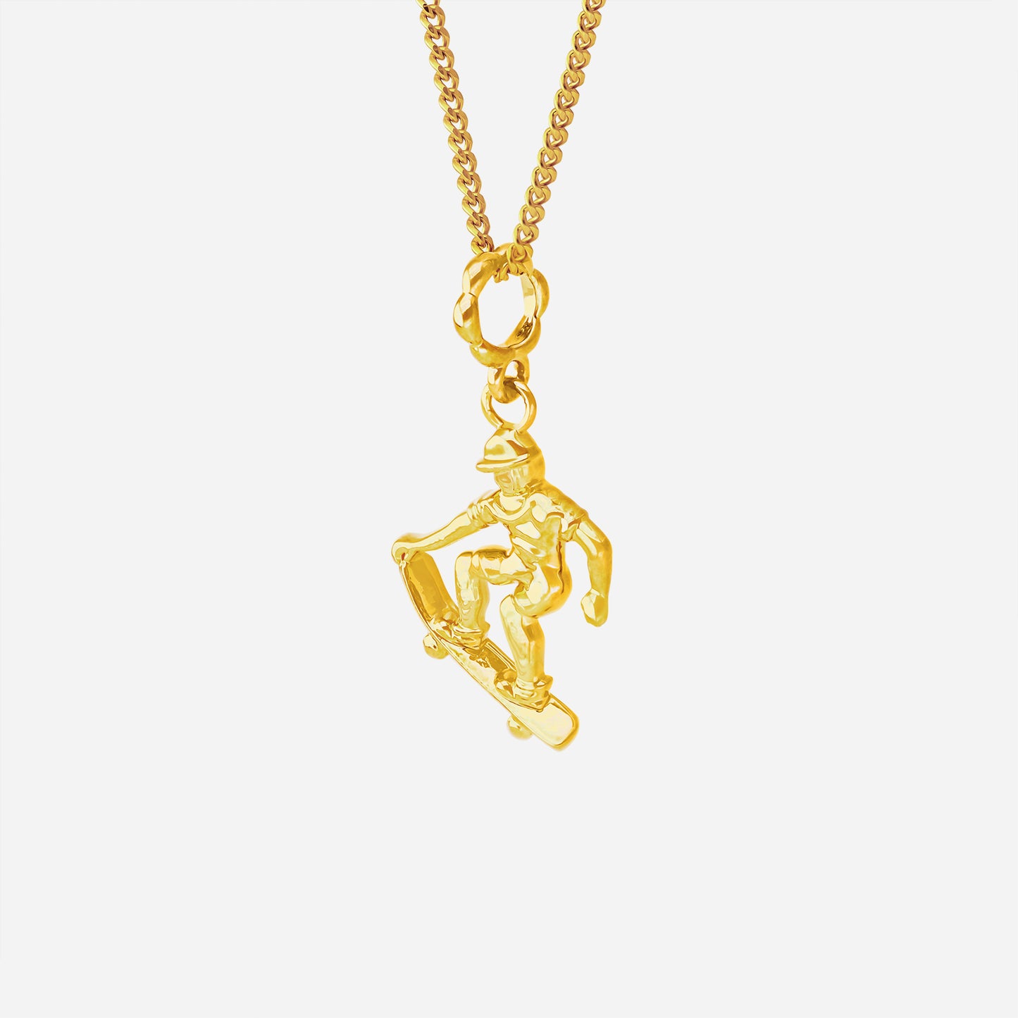 ace of skateboarding pendant in 22k yellow gold featuring a sculpted skateboarder in motion. chain sold separately.