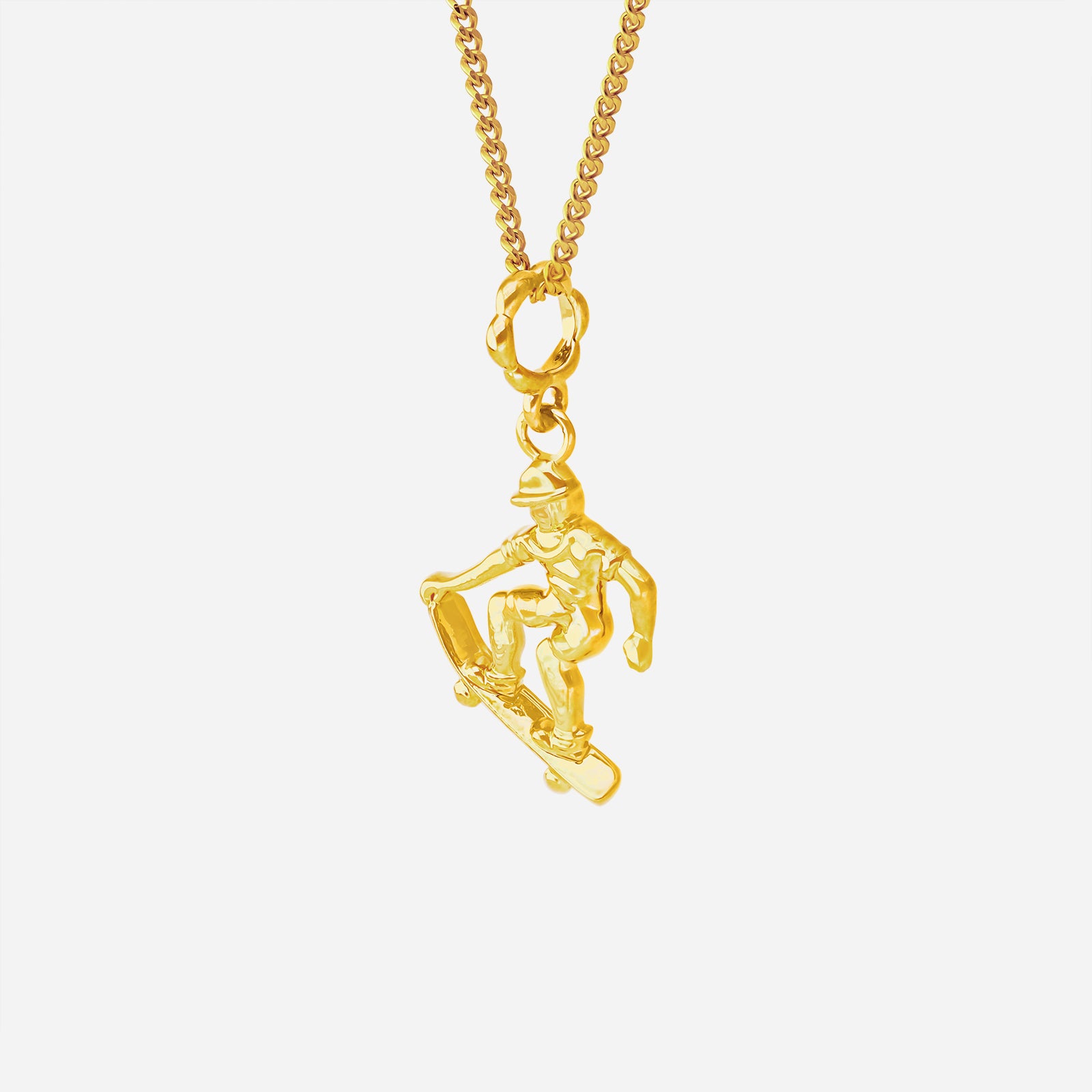 Ace of Skateboarding Pendant in 22K yellow gold featuring a sculpted skateboarder in motion. Chain sold separately.