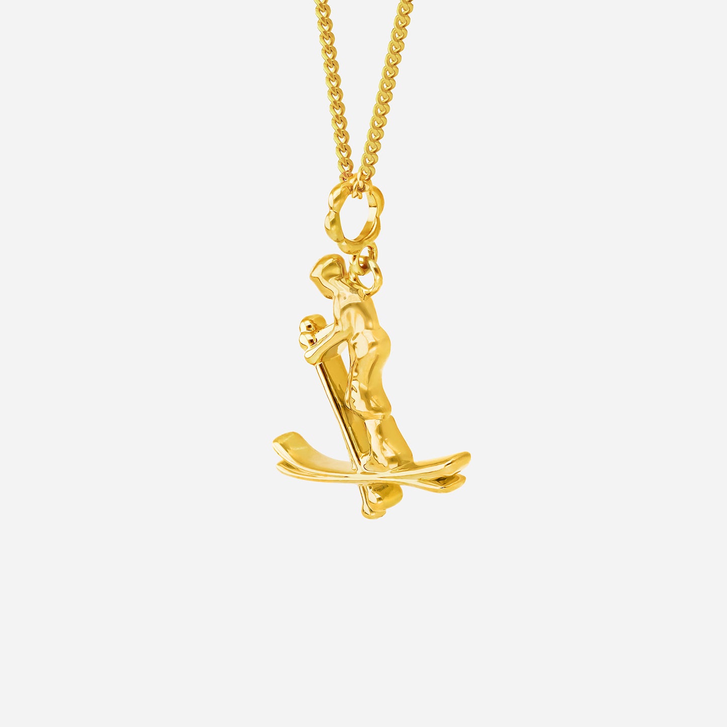 ace of skiing pendant in 22k yellow gold featuring a dynamic skier in motion design. perfect for skiing enthusiasts.