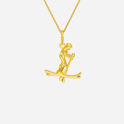 22K yellow gold skiing pendant featuring a dynamic skier in motion, symbolizing confidence and daring adventures.