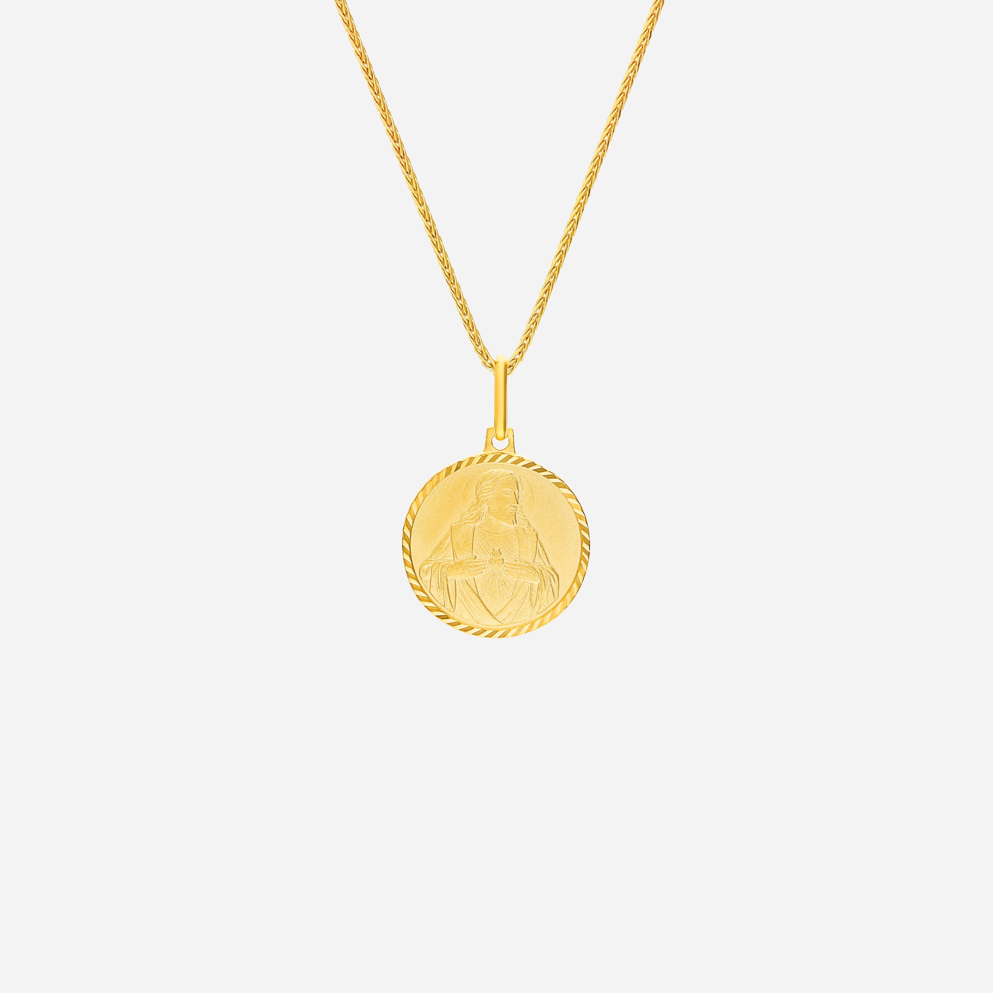 Sacred Heart Pendant in 22K yellow gold with intricate design, featuring a textured round medallion. Chain not included.
