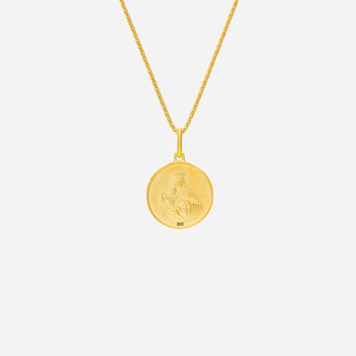 sacred heart pendant in 22k yellow gold with intricate design, symbolizing faith and compassion. chain sold separately.