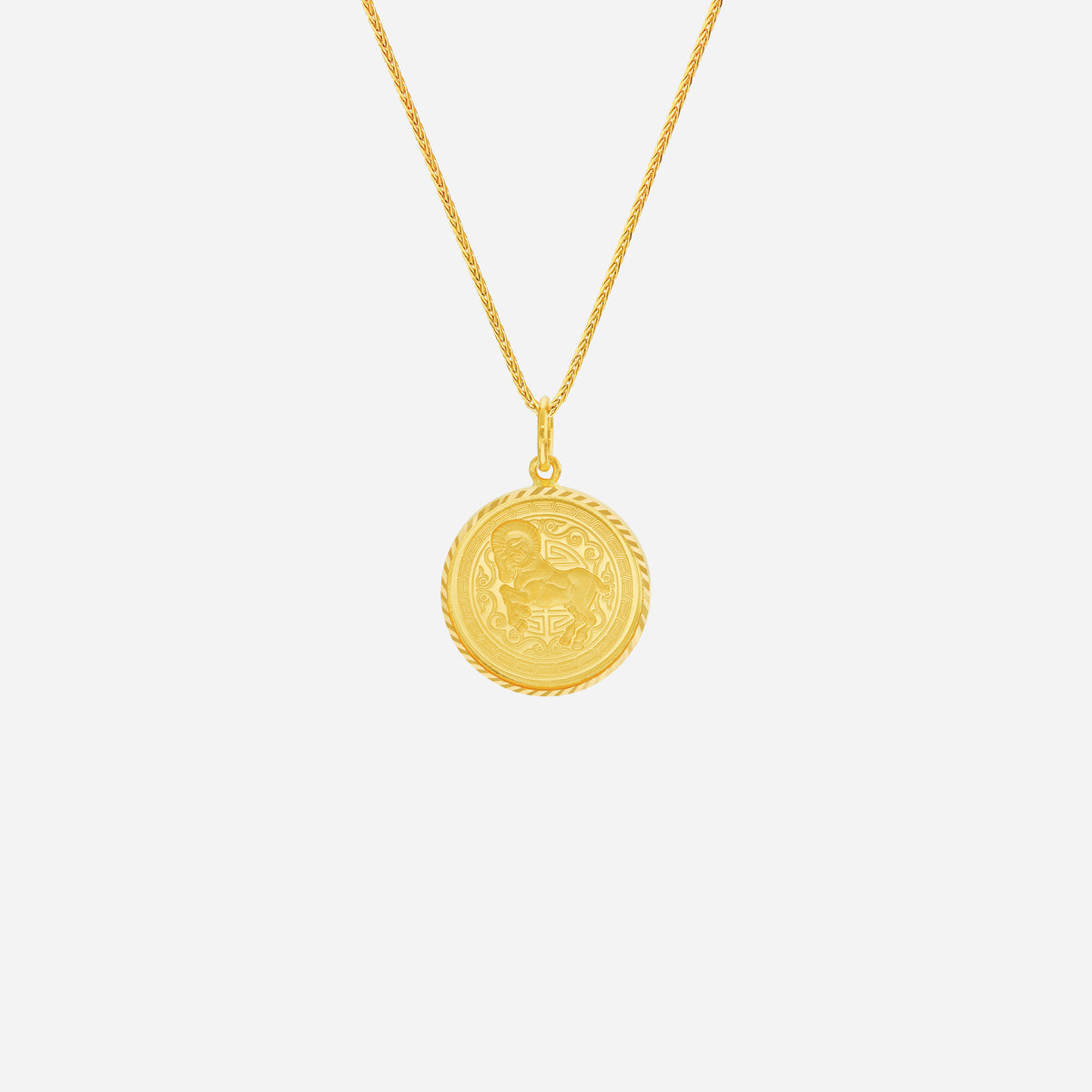 Prosperity Goat Pendant in 22K yellow gold with a detailed goat design and rope-edge finish. Chain not included.