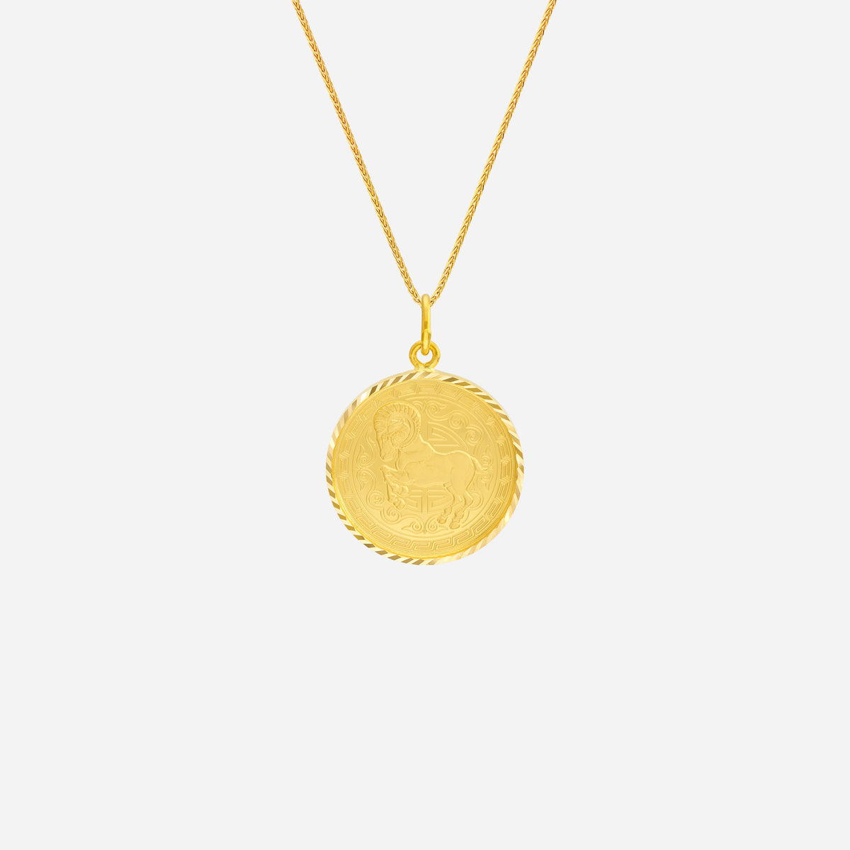 Prosperity Goat Pendant in 22K yellow gold with intricate goat design and twisted edge detail. Chain sold separately.