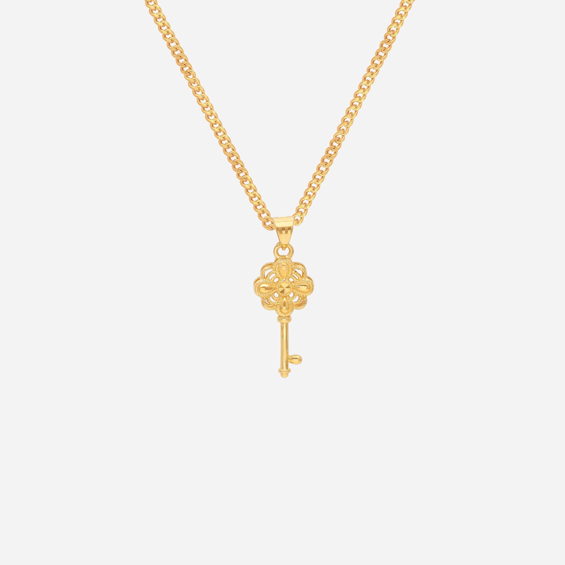 Petal Key Pendant in 24K yellow gold featuring an intricate petal-inspired design. Chain not included.