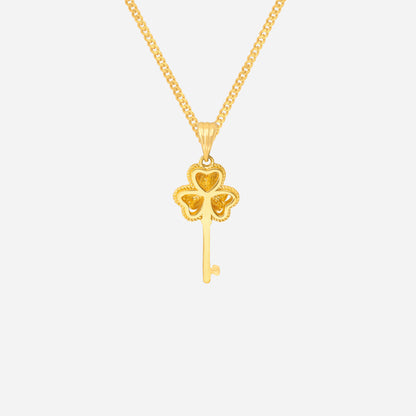 Clover key pendant in 24K yellow gold featuring a four-leaf clover design with a slender key.