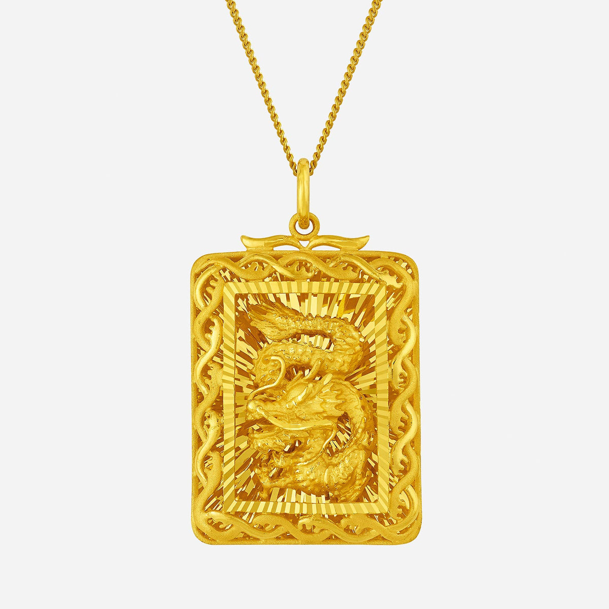 golden blessing pendant in 24k yellow gold with a dragon design, intricately carved and framed in a radiant setting.