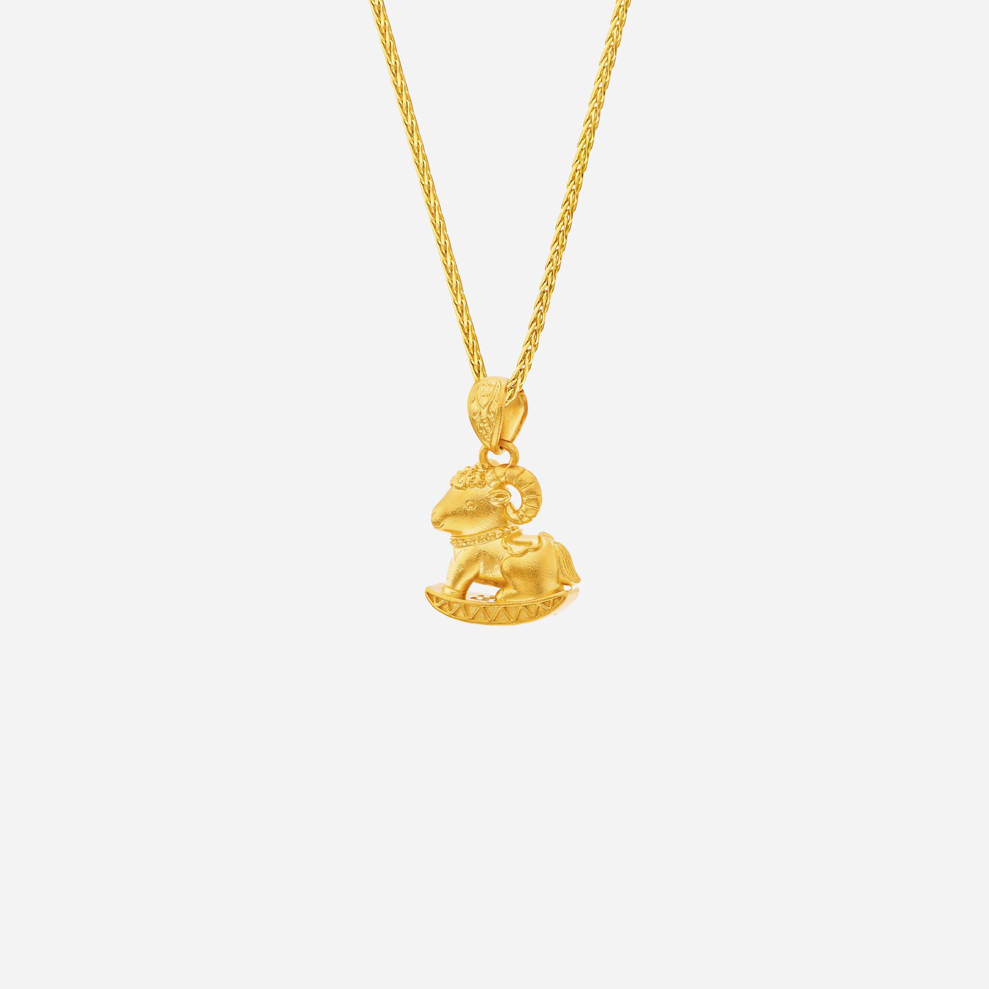 Prosper Goat Pendant in 24K Yellow Gold, detailed goat design symbolizing fortune and tranquility, on a twisted gold chain.