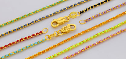 Colorful woven chains with yellow gold links, featuring green, blue, red, and purple tones, suitable for pendants.